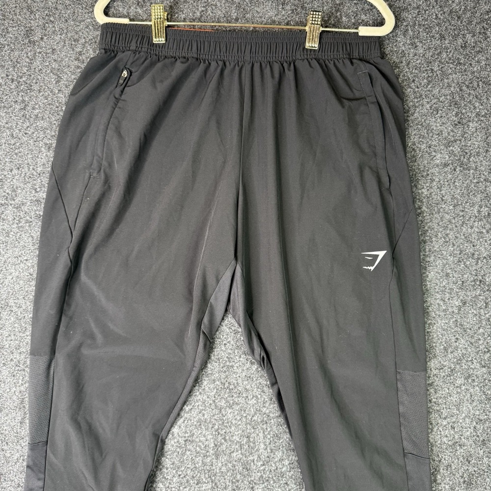 Gymshark Mens M Black Training Pants Tapered Zip Pockets Mesh Panel Athletic